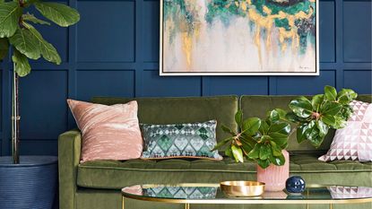 Living room with royal blue living room wall panelling ideas and moss green velvet sofa