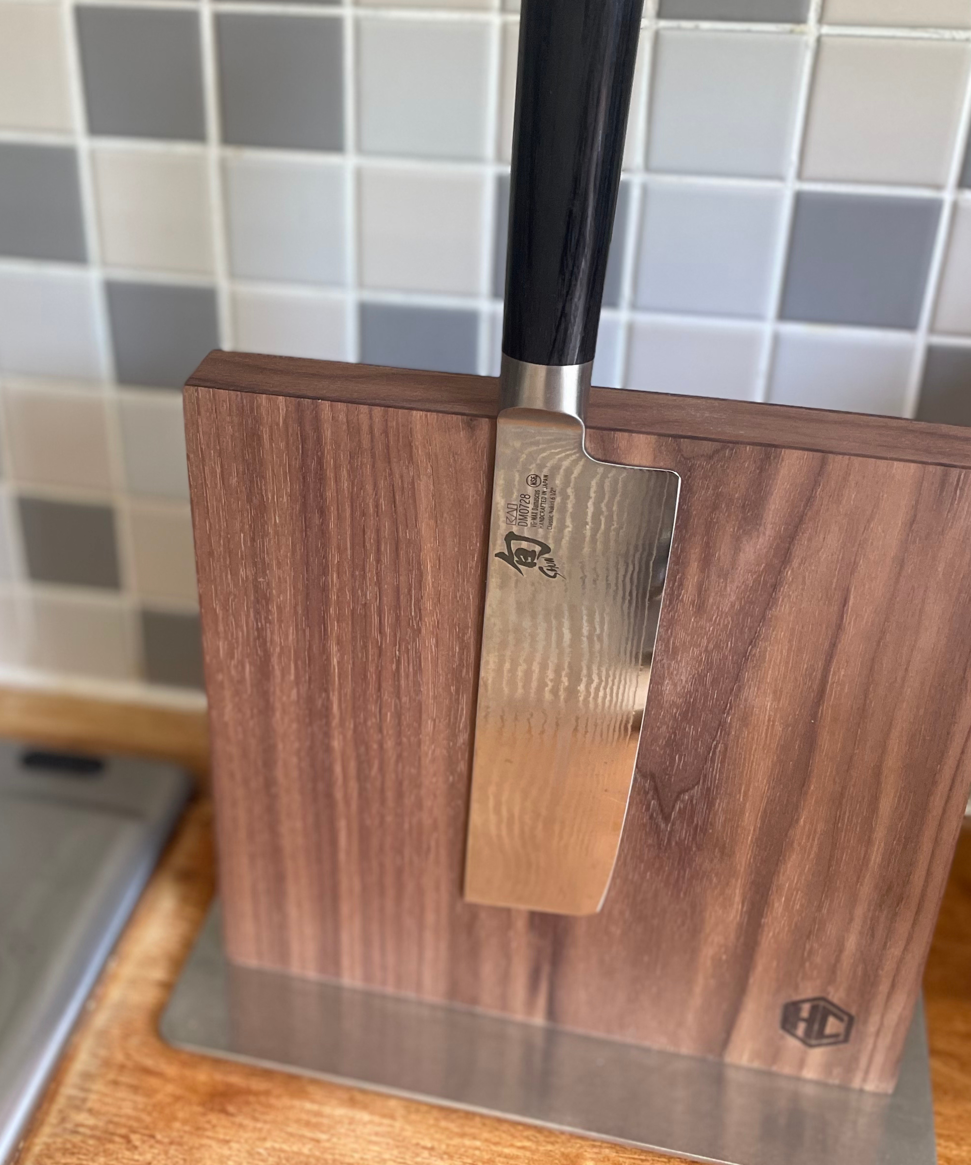 The Shun Nakiri Knife in black on my magnetic walnut wood board