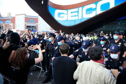NYPD officers and protesters at Barclays Center.