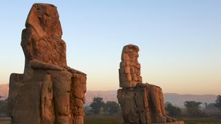 Egypt, Nile Valley, Luxor, Thebes, West bank of the River Nile, Two giant statues known as the Colossi of Memnon carved to represent the pharaoh Amenhotep III of the dynasty XVIII