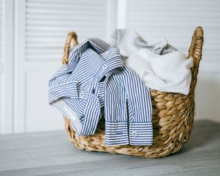 wicker basket with striped shirt and laundry