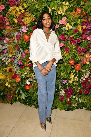 Ayo Edibiri wears Bottega Veneta leather blue jeans and silver wedges at Tiffany & Co. BAFTA afterparty