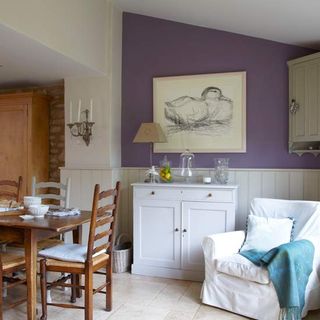 dining room with photoframe on purple wall