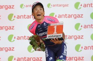 Yukiya Arashiro on the stage 6 Tour de France podium after winning the combativity prize