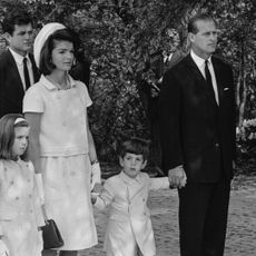 Jackie Kennedy, widow of assassinated US President John F. Kennedy, with her children Caroline and John F. Kennedy Jr., who held hands with Prince Philip at Runnymede for The Kennedy Memorial Stone ceremony May 14, 1965