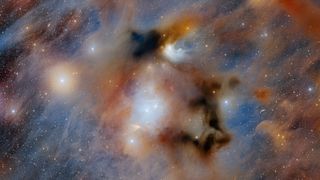 The ominous Chamaeleon I dark cloud, the nearest star-forming region to Earth, is captured in this image taken with the 570-megapixel Department of Energy-fabricated Dark Energy Camera mounted on the U.S. National Science Foundation Víctor M. Blanco 4-meter Telescope at Cerro Tololo Inter-American Observatory, a Program of NSF NOIRLab.