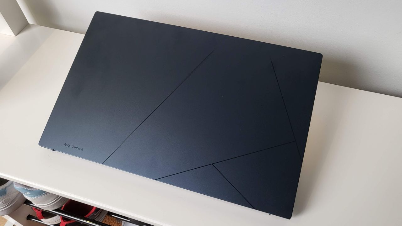 Asus Zenbook OLED 15 (2023) on a shelf