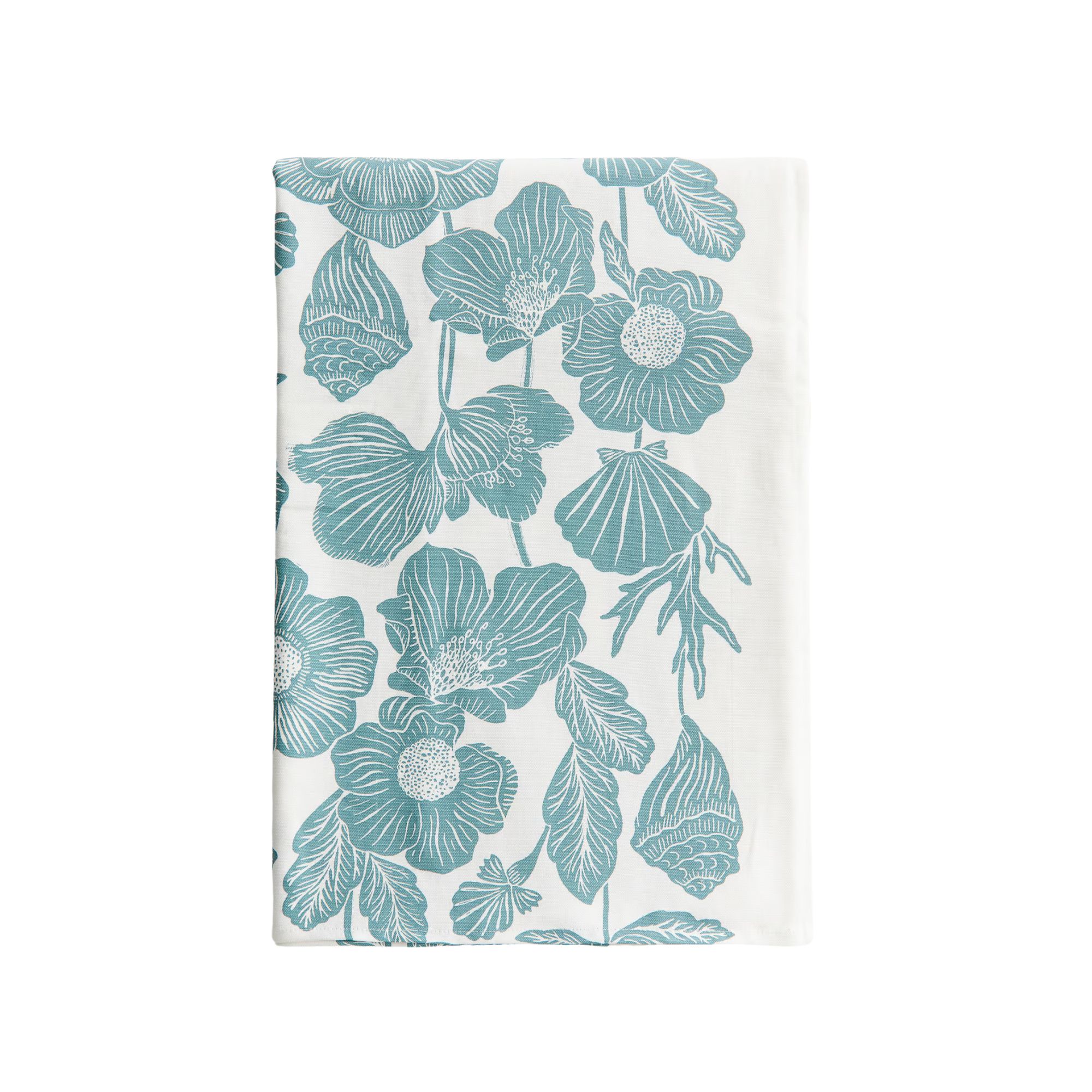 A folded white tablecloth with a teal blue shell, coral, and flower pattern