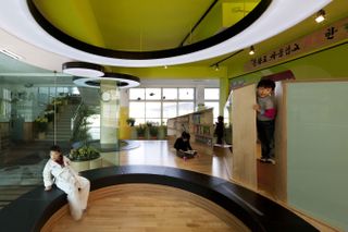 Elementary school of korean architecture with kids reading books