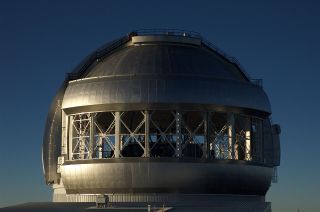 a silver telescope dome with a large opening