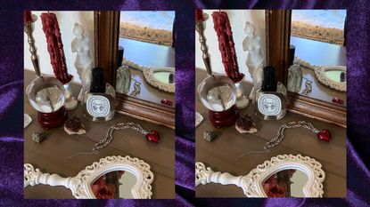 Dresser with mirror, candle, perfume, and necklace