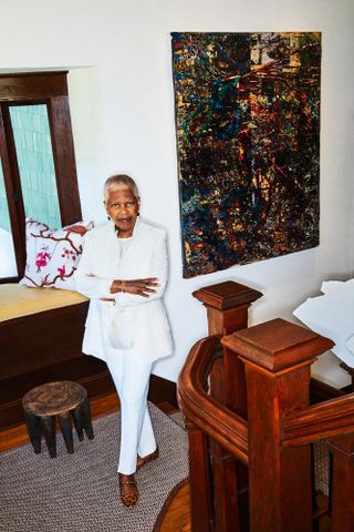 Portrait of Eileen Harris Norton in her Santa Monica home. In the background is Unfamiliar Money, 2019, a mixed media work on canvas by American artist Mark Bradford. Courtesy of the Eileen Harris Norton Collection