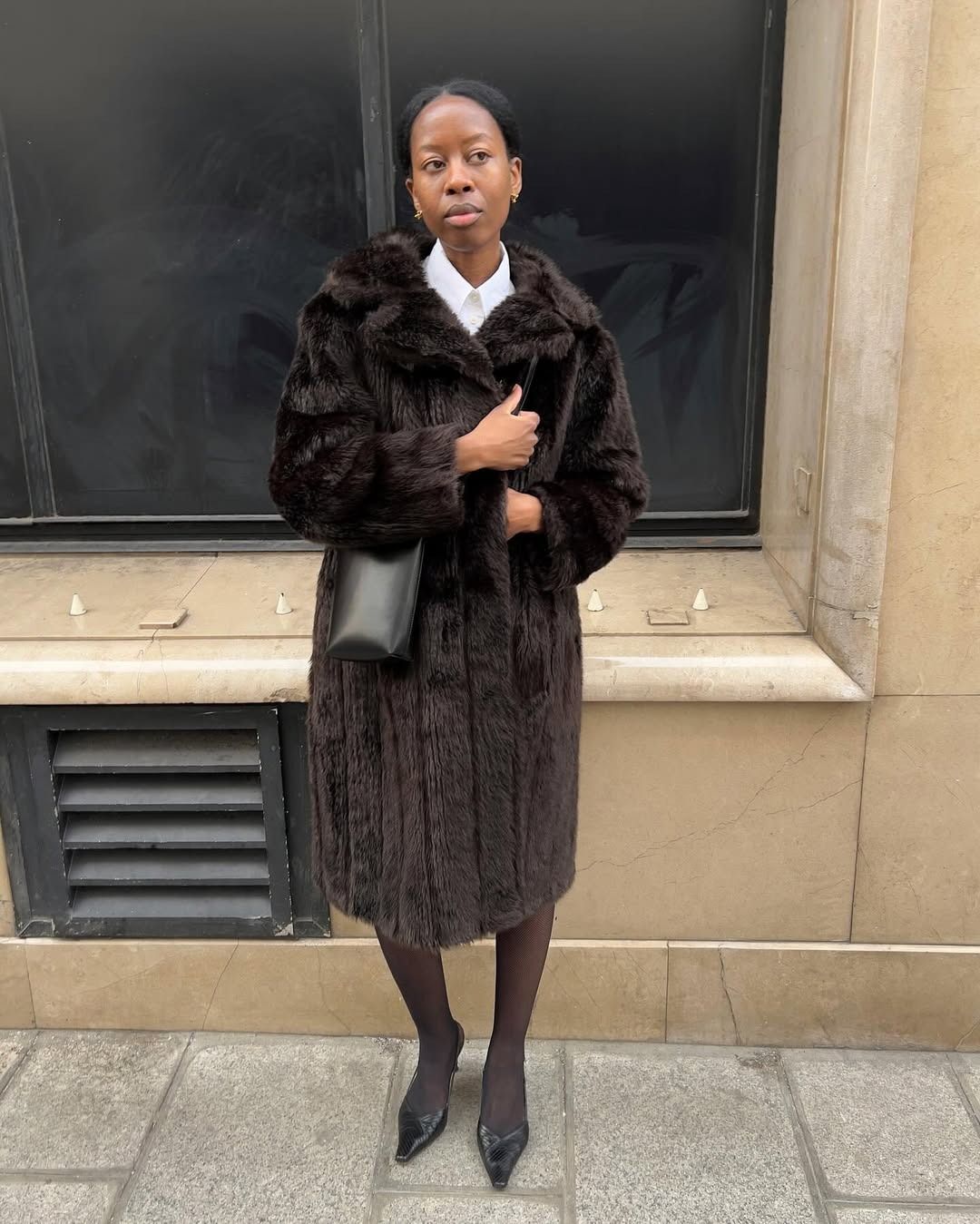 Influencer Sylvie Mus wearing a fur brown coat.