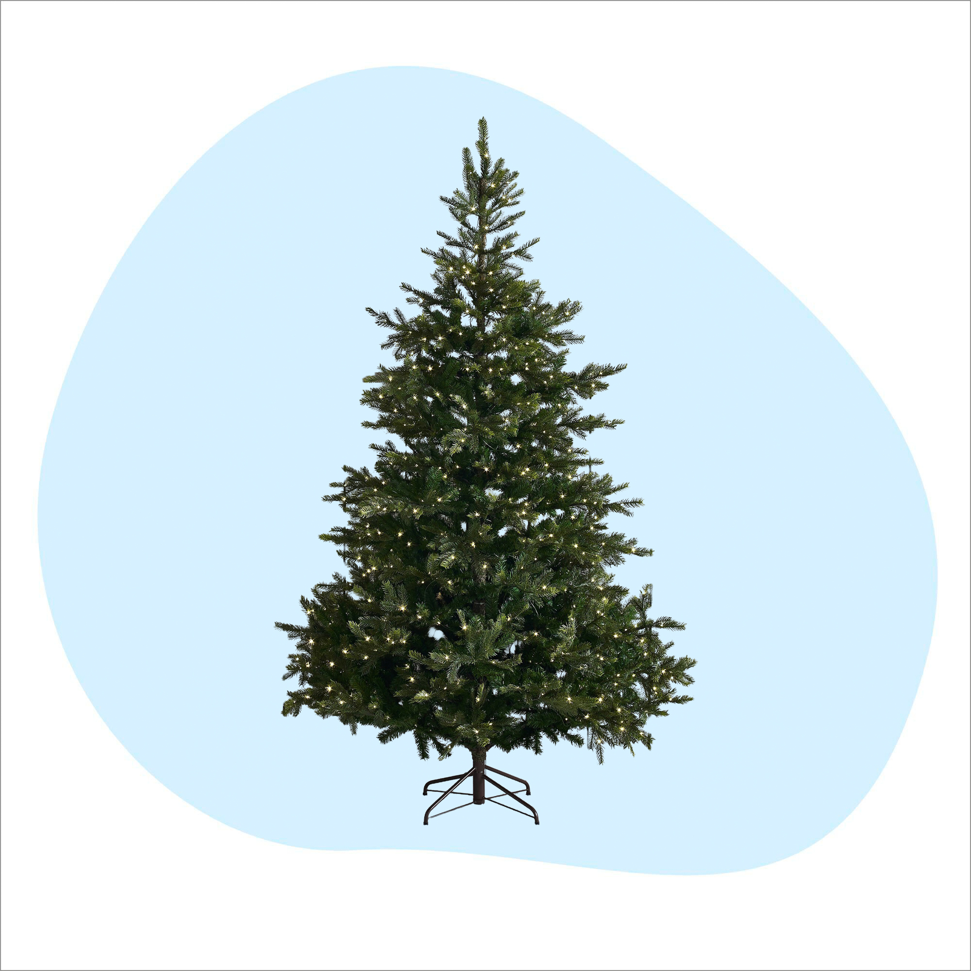 The White Company Pre Lit Grand Spruce Christmas Tree on a blue and white background