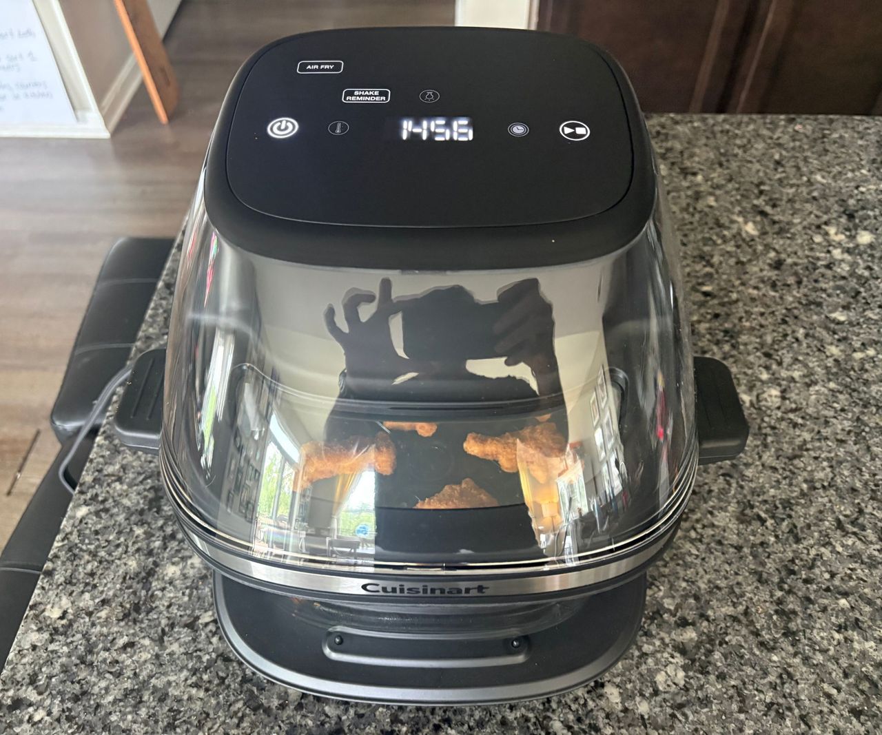 The Cuisinart glass air fryer on a granite countertop