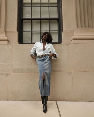 Amy Julliette Lefévre wears knee-high boots with a denim skirt