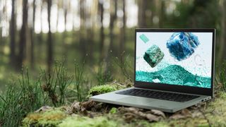 Acer Chromebook Vero 514 sitting on mossy stump in forest