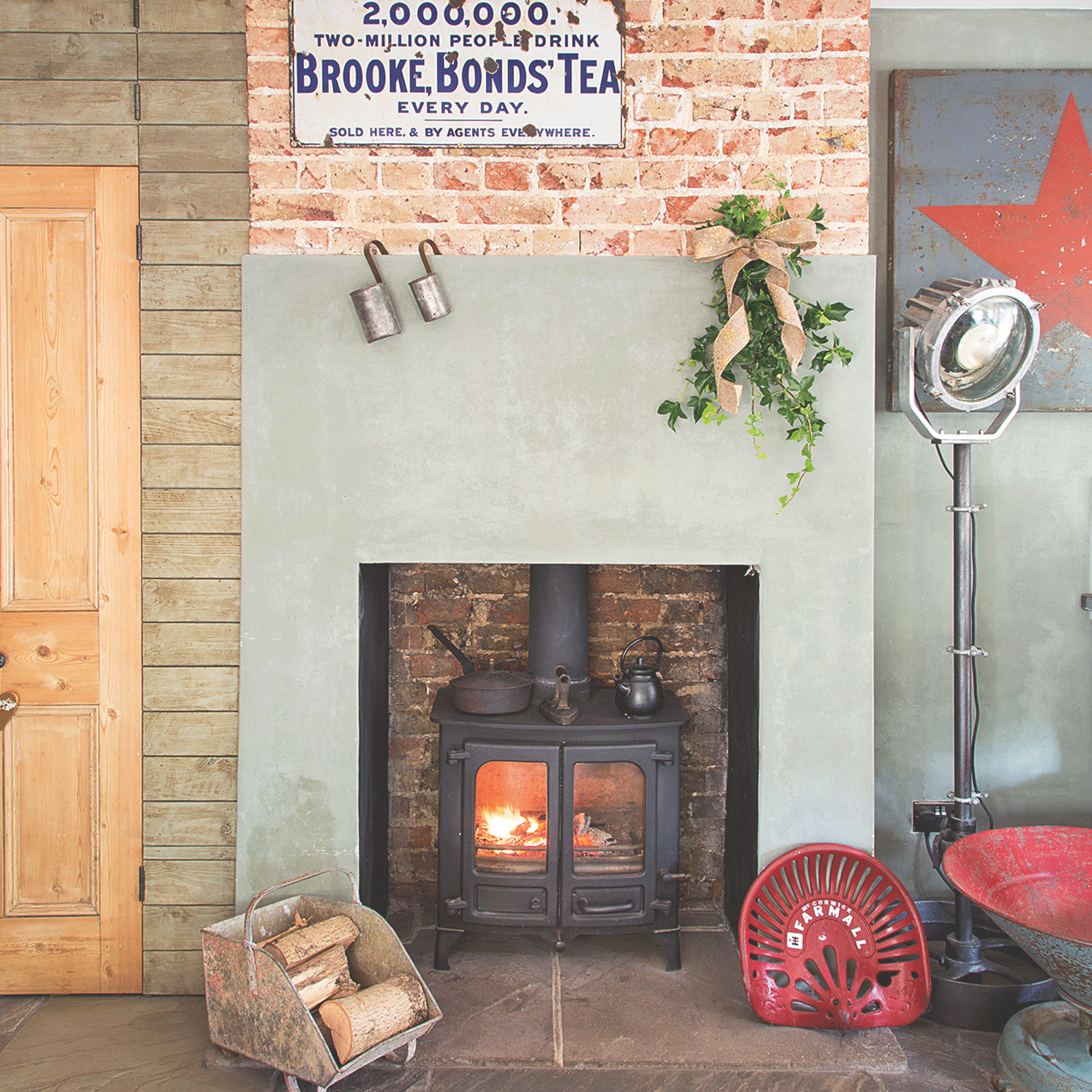 Fireplace with stove and wood storage bucket
