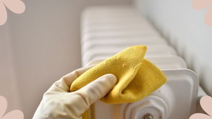 Person using a microfibre cloth to show how to clean radiators 