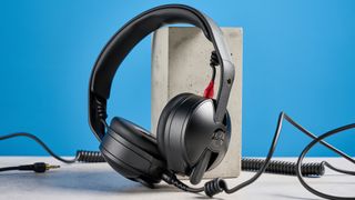 the rode nth-50 studio headphones in black showing the long cable, 3.5mm jack, 1/4 jack, and in use