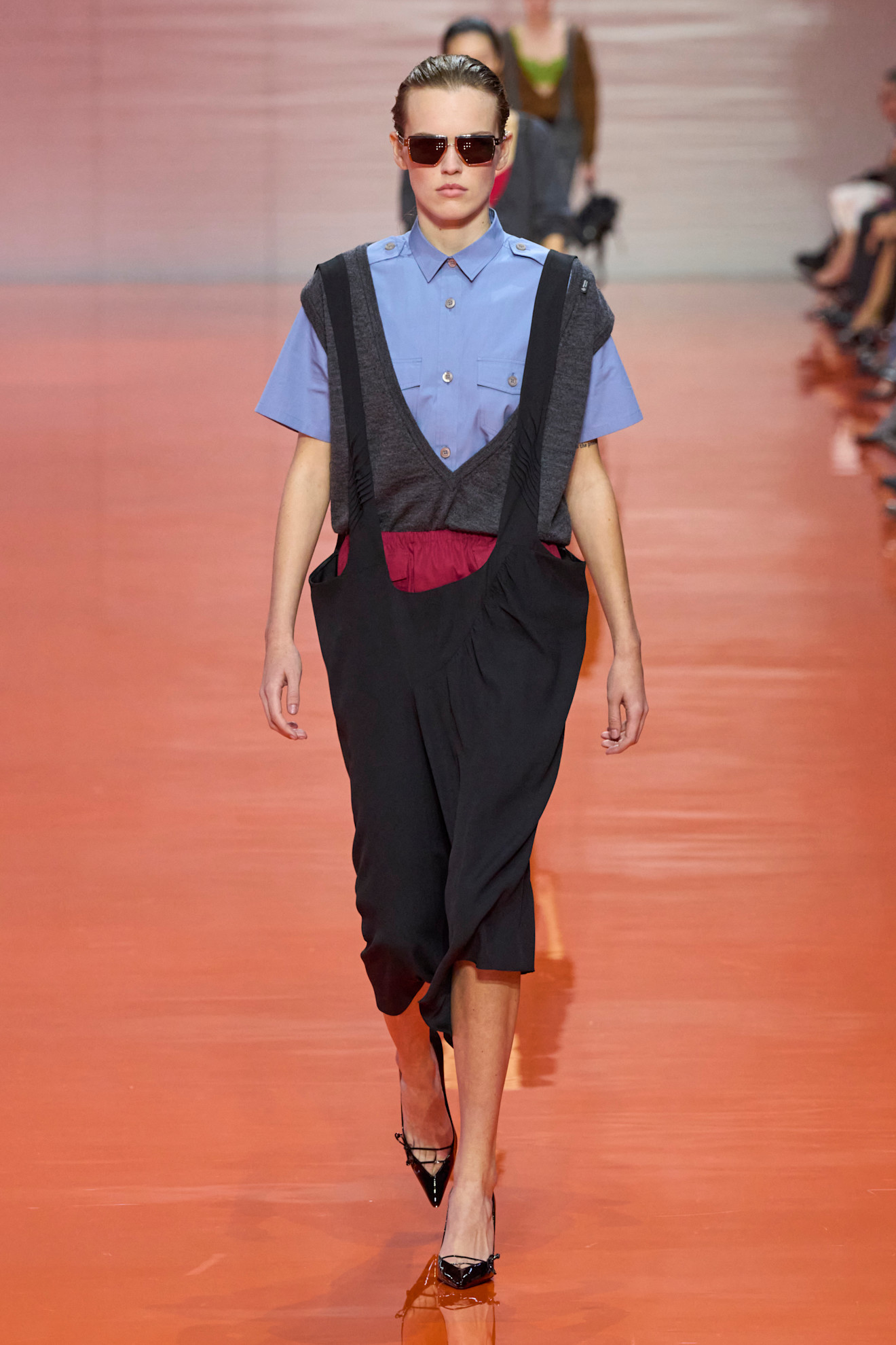 A model wore red and blue together on the Prada Spring 2026 runway
