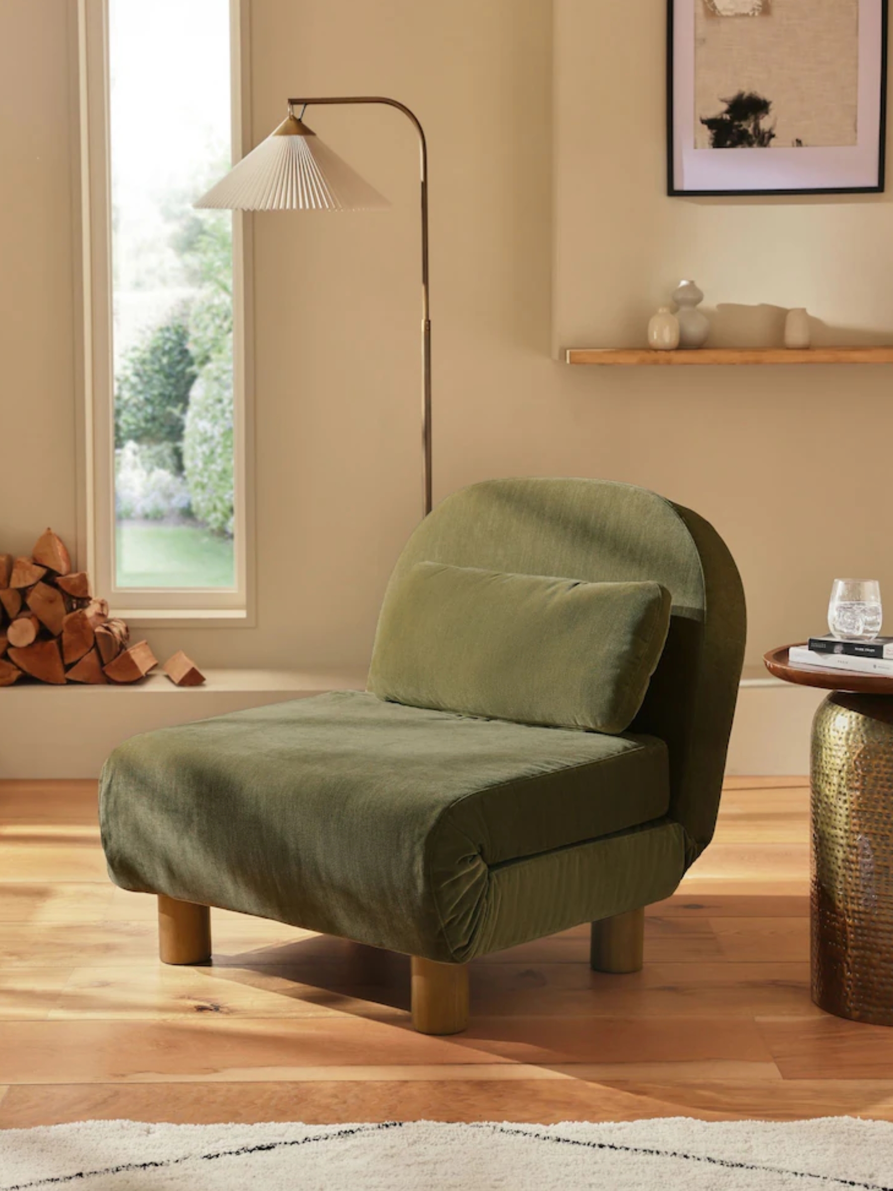 a folding green sofa chair in a modern home