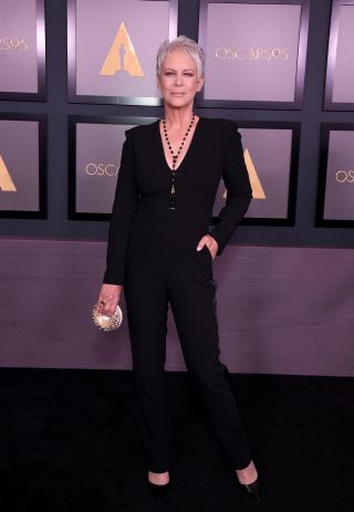 Jamie Lee Curtis on the red carpet with an everything bagel clutch.