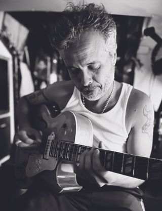 Diego Garcia, a.k.a. Twanguero, plays his 1955 ES-295 on his boat, Panamerica.