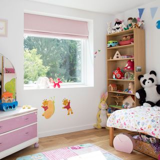 bedroom with toys and wooden shelve