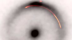 A black and white image of an Einstein ring with a red a yellow arc highlighted within its halo