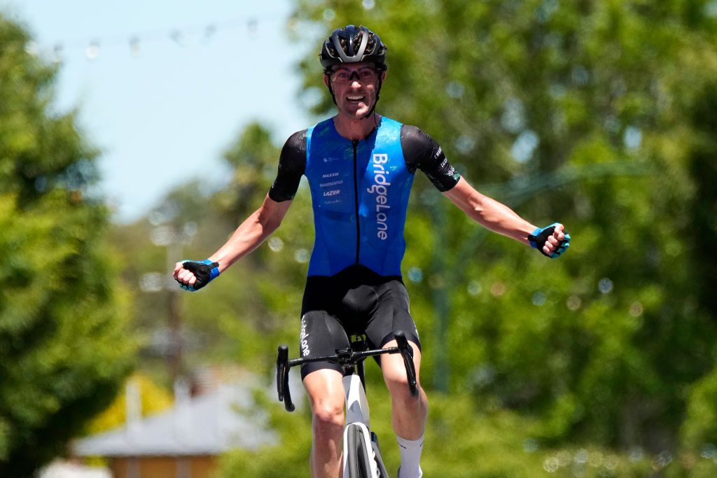 Jimmy Whelan celebrates victory on the opening stage of the 2022 Santos Festival of Cycling 