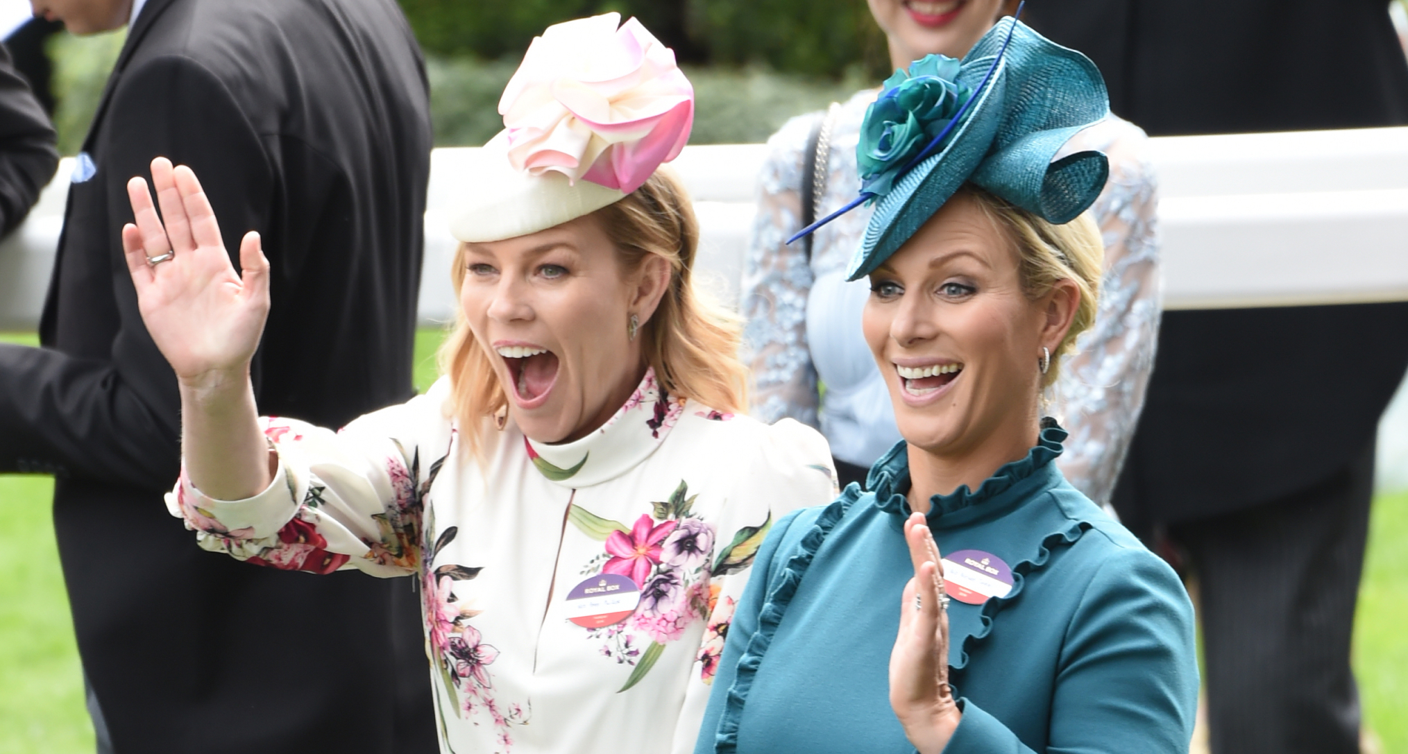Zara Tindall and Autumn Kelly laughing at Royal Ascot and waving