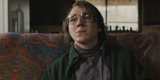 Alex Jones (Paul Dano) sits on a couch in a scene from 'Prisoners'