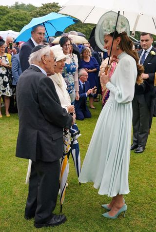 Britain's Catherine, Duchess of Cambridge meets with guests at a Royal Garden Party at Buckingham Palace in London on May 25, 2022