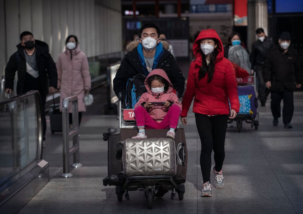 Travelers wear masks to protect themselves from Wuhan coronavirus.