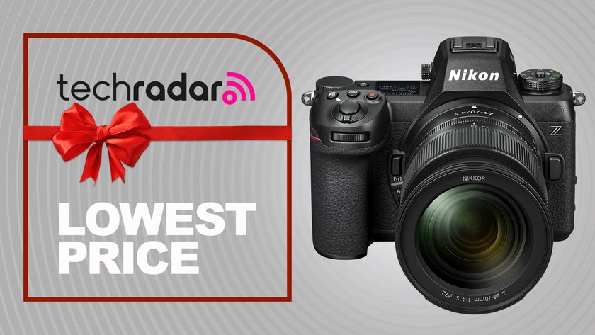 Nikon Z6 III fitted with the Nikkor Z 24-70mm f/4S lens on a grey TechRadar deals background for lowest price