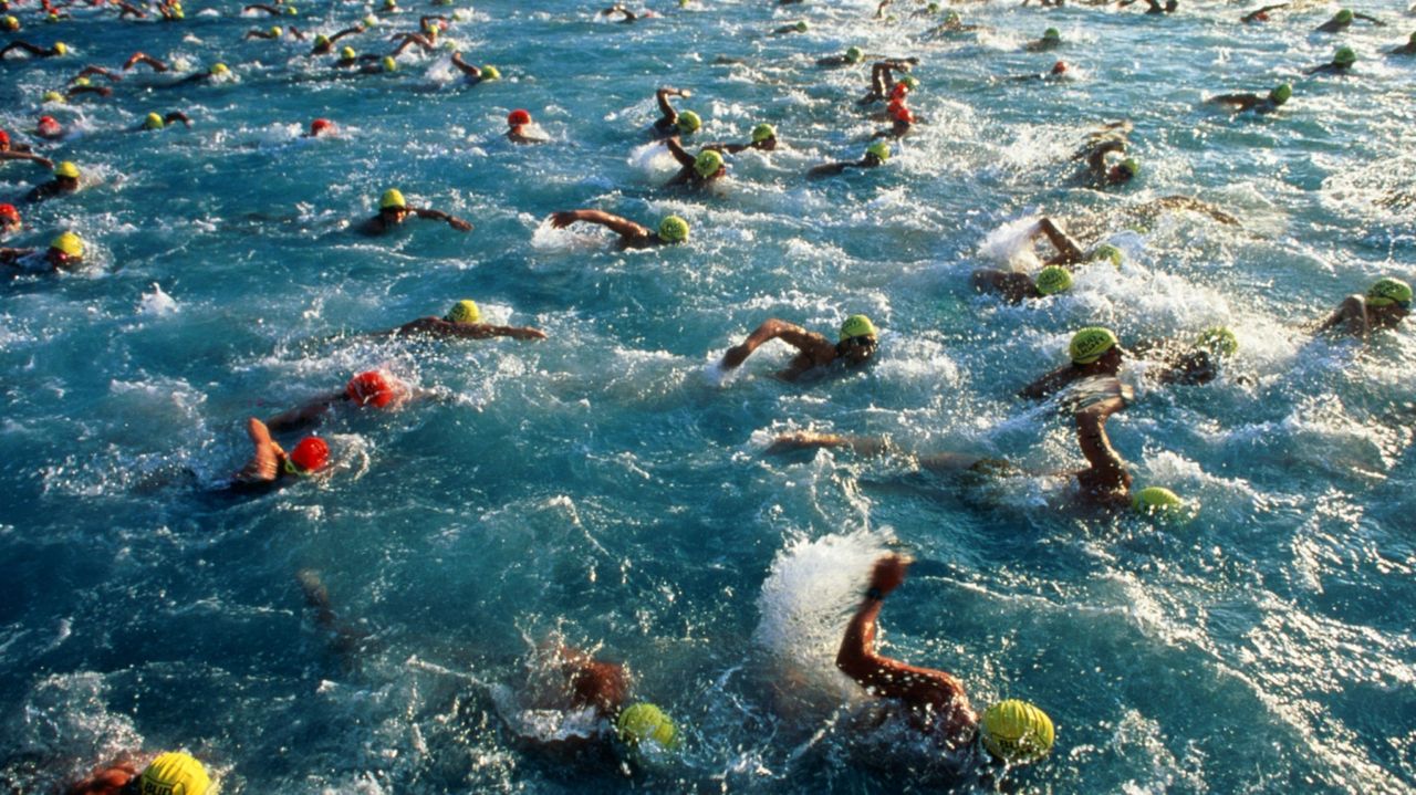 Swimmers in the water on an Ironman Triathlon event