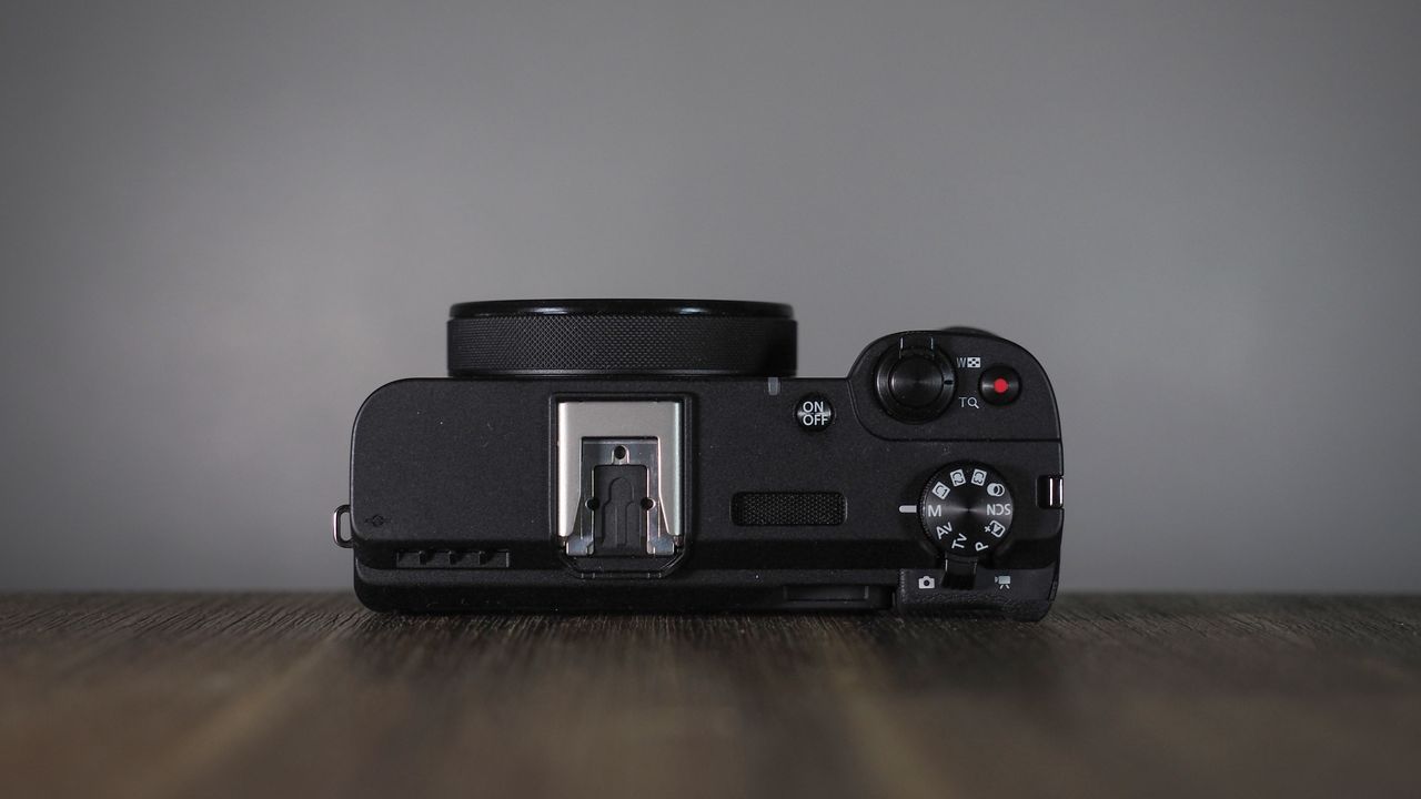 Canon PowerShot V1 on a wooden surface