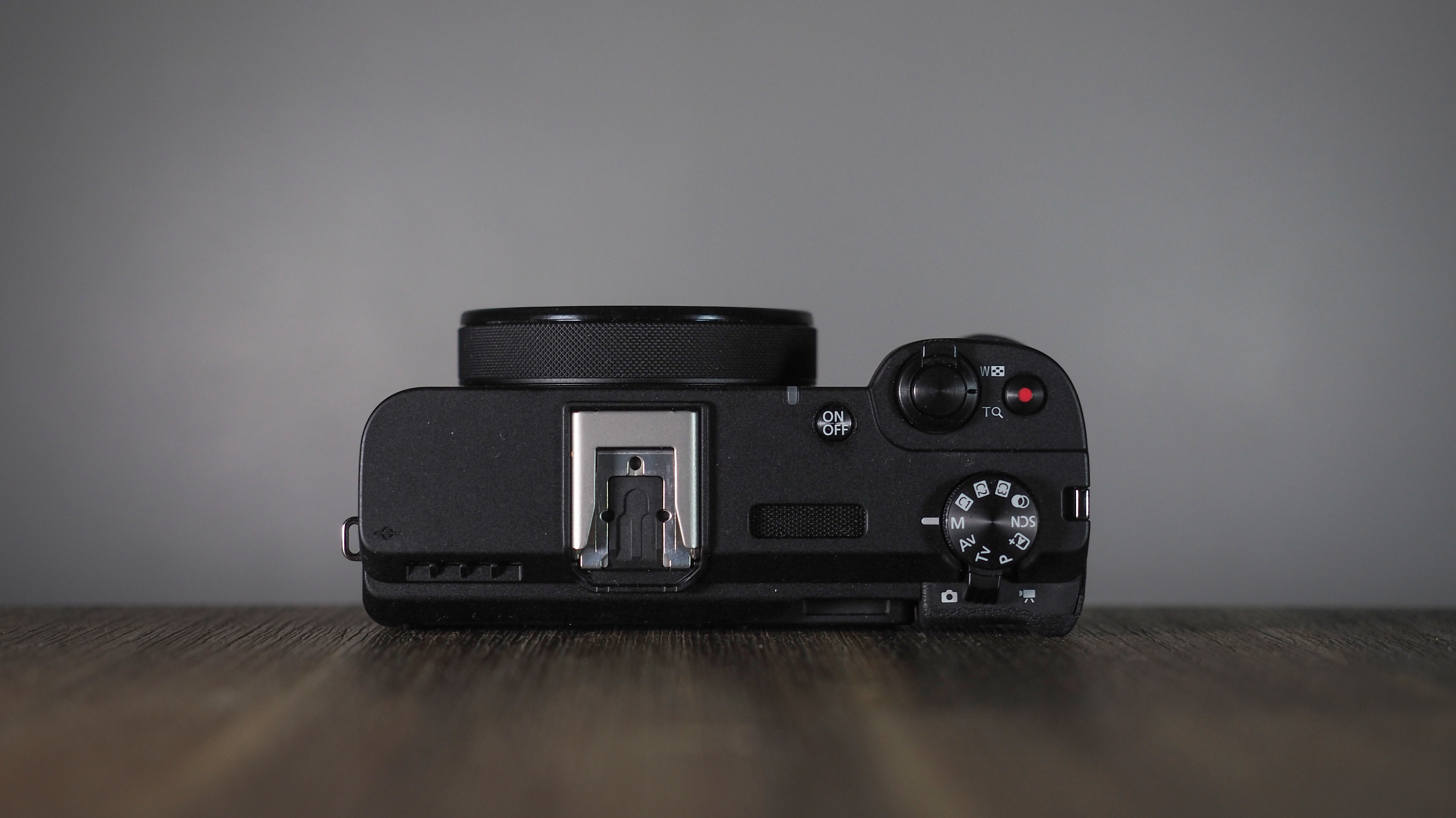Canon PowerShot V1 on a wooden surface
