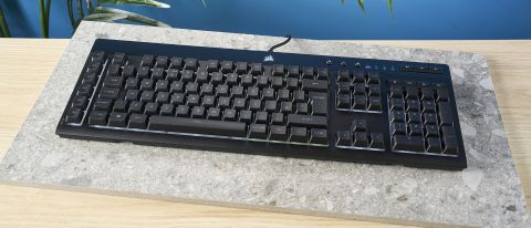 A black Corsair K55 RGB Pro wired gaming keyboard with rubber dome switches