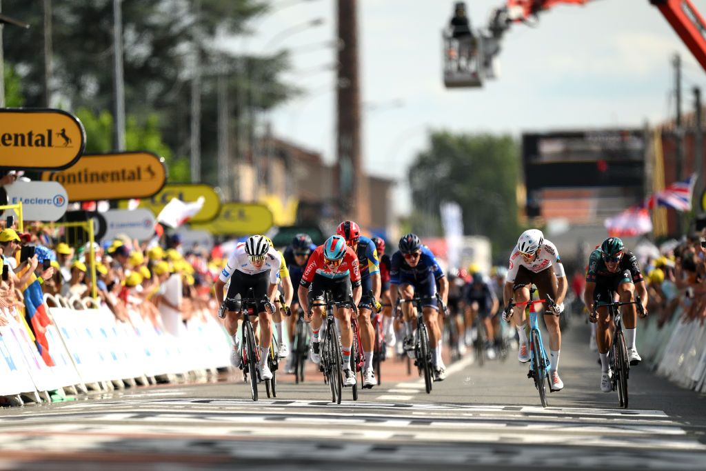 BELLEVILLEENBEAUJOLAIS FRANCE JULY 13 LR Tadej Pogacar of Slovenia and UAE Team Emirates White best young jersey Maxim Van Gils of Belgium and Team Lotto Dstny and Clment Berthet of France and Ag2R Citron Team sprint at finish line during the stage twelve of the 110th Tour de France 2023 a 1688km stage from Roanne to Belleville en Beaujolais UCIWT on July 13 2023 in Belleville en Beaujolais France Photo by David RamosGetty Images