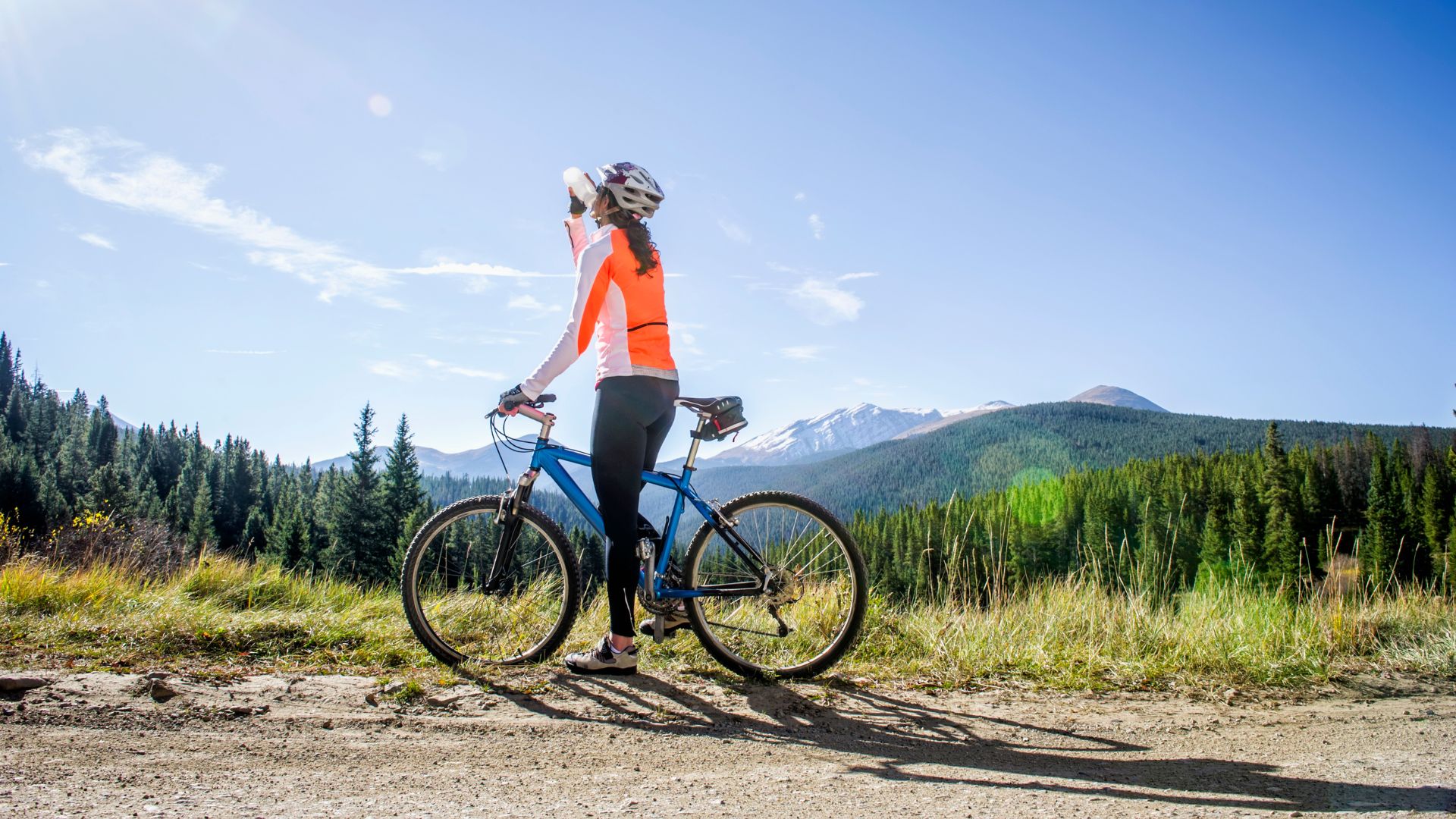 Woman drinking water on bike ride