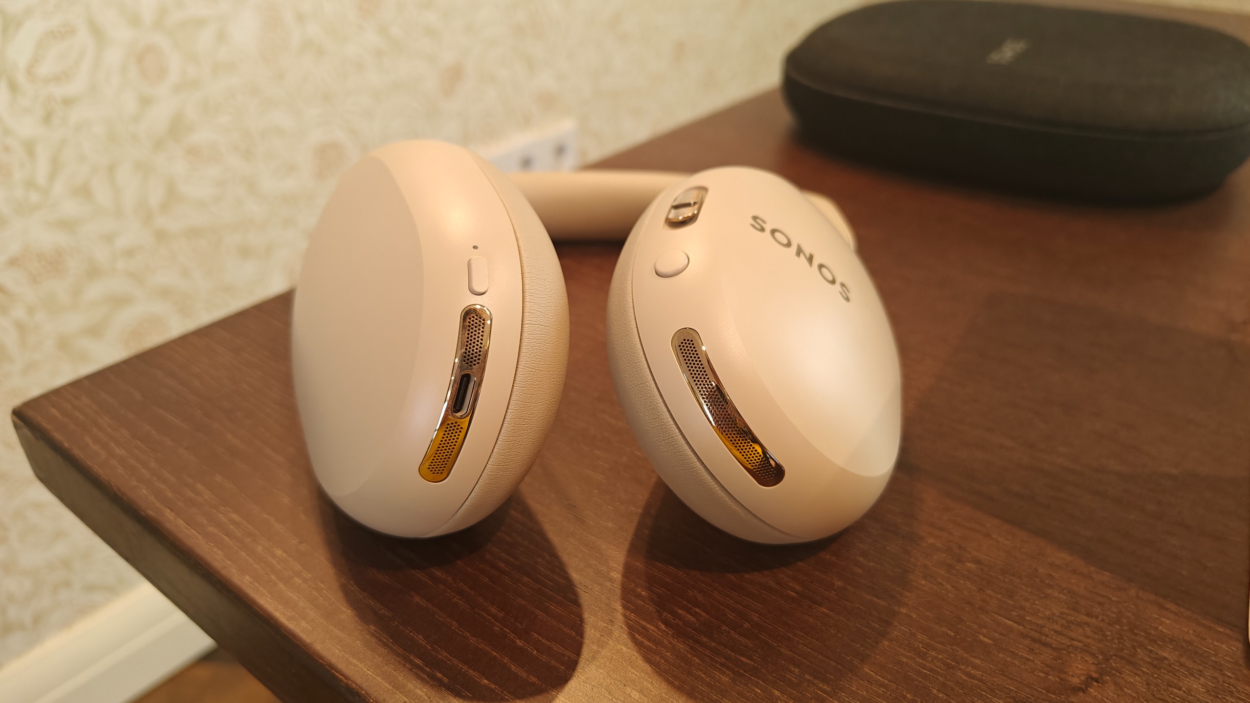 Sonos Ace Ultra on a brown table.