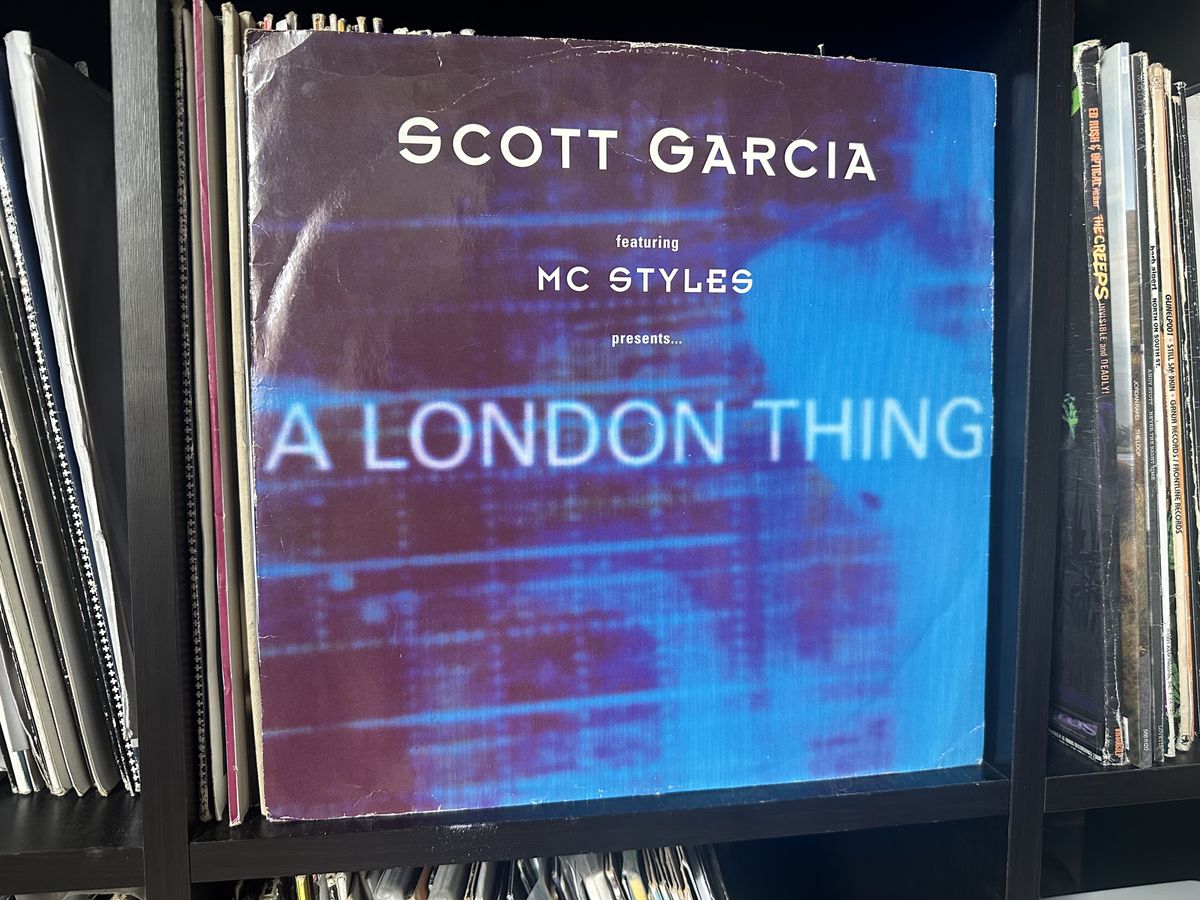 The sleeve of Scott Garcia's A London Thing on vinyl, propped up against some more records. The cover is mostly blue.