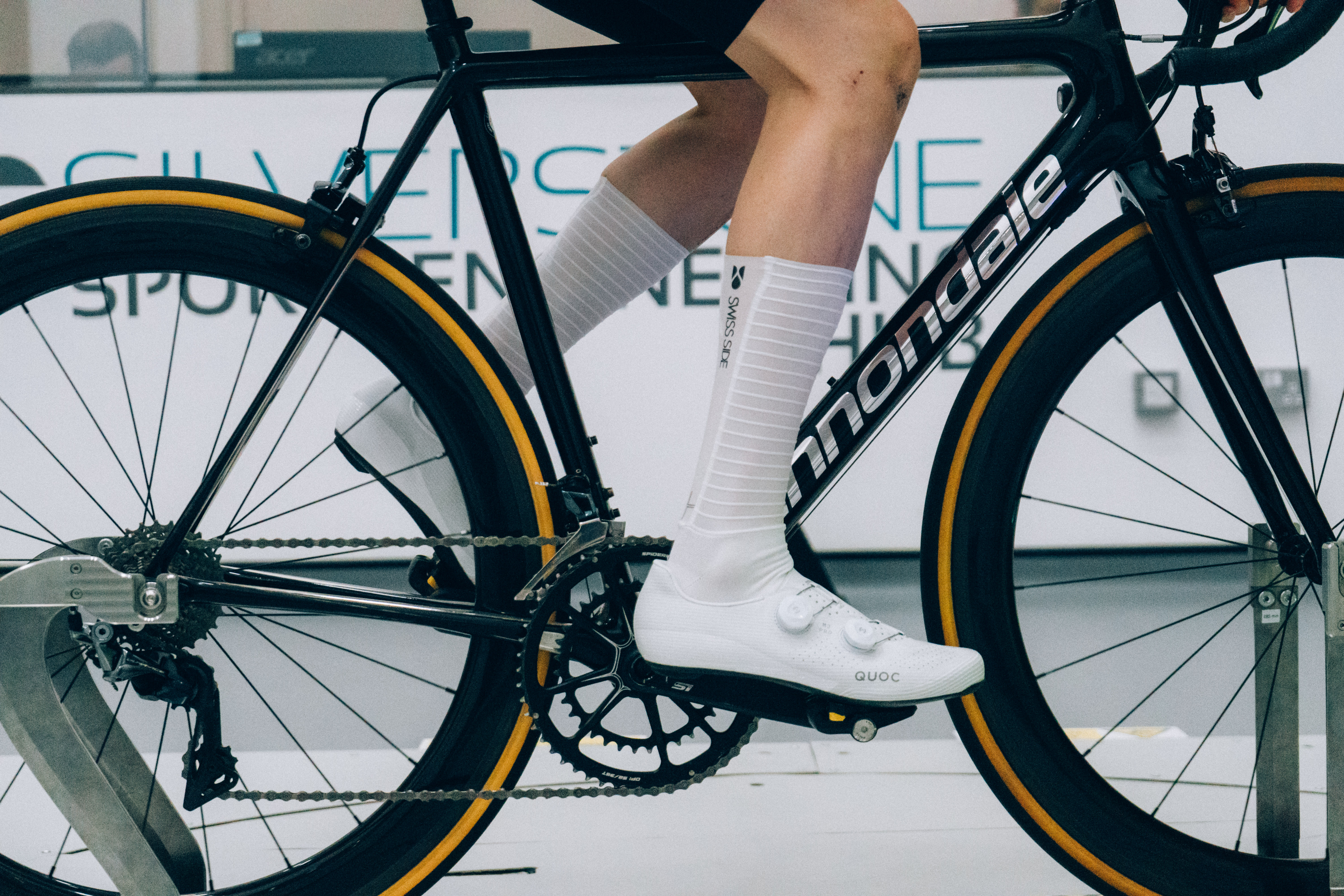 A close up of the socks that Tom is wearing while riding a bike in the wind tunnel