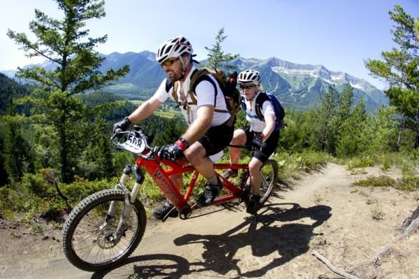 Thomas Miller and Karen Libsch are racing together on a tandem