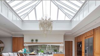 large roof lantern in kitchen with chandelier