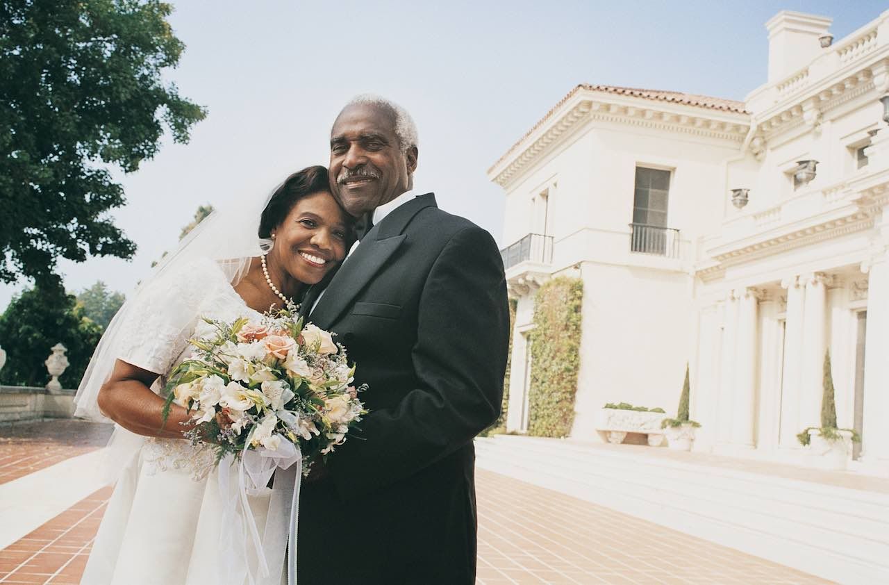 Portrait of Senior Newlyweds Standing in a Garden