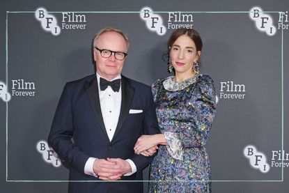 Actor Jason Watkins and his wife Clara Francis posing together on the BFI red carpet