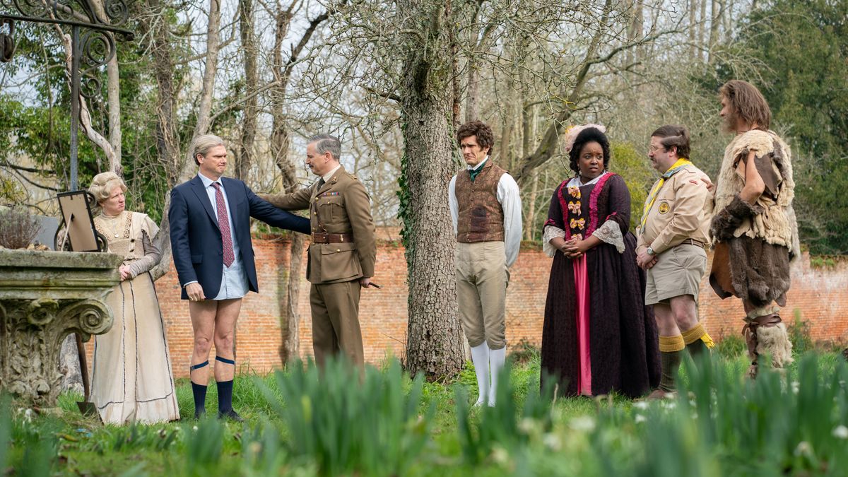 Ghosts UK cast standing in the garden of Button House.